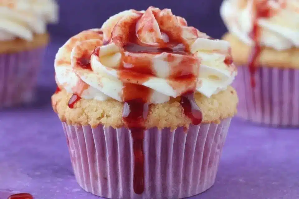Chocolate Cupcakes Stuffed with Pumpkin Cheesecake 4 Chocolate cupcakes filled with pumpkin cheesecake, a festive dessert delight.