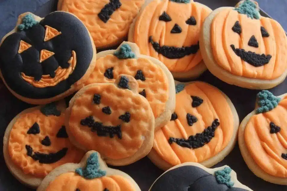 Easy Halloween pumpkin sugar cookies decorated with festive icing