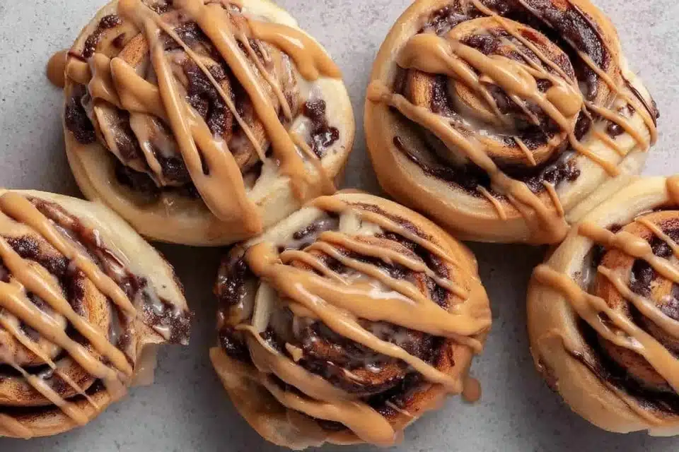 Vegan Mocha Cinnamon Rolls with Chocolate Espresso Glaze: The Ultimate Comfort Food 4 Vegan mocha cinnamon rolls with chocolate espresso glaze on a rustic plate