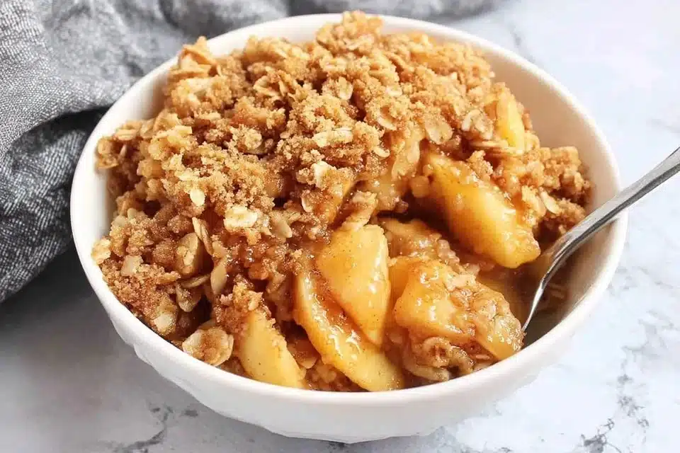 Classic apple crisp dessert with apples and crunchy topping in a baking dish