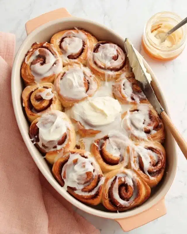 Delicious easy cinnamon roll icing drizzled over warm cinnamon rolls.