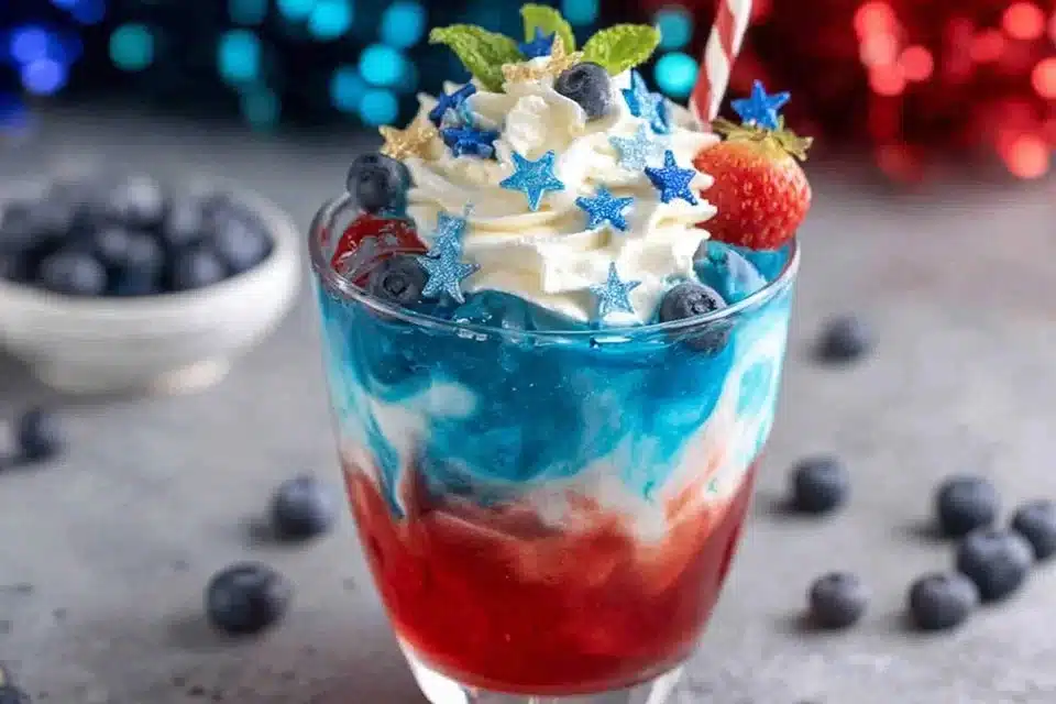 Red, White & Blue Sparkling Drink in festive glasses with fruit garnishes