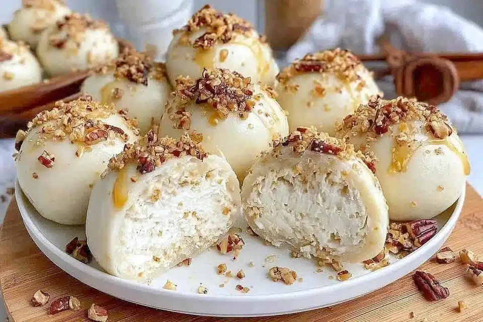 White chocolate coconut truffles garnished with coconut flakes.