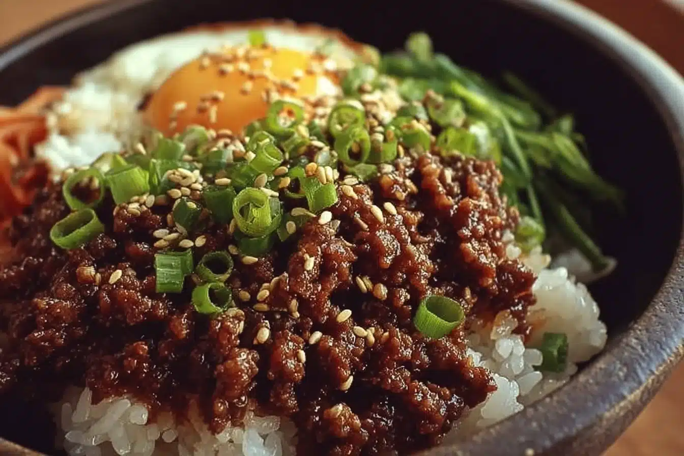 Korean Ground Beef Bowl 3 Korean Ground Beef Bowl with vegetables and sauce served in a bowl