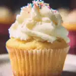 Perfect Vanilla Cupcakes topped with creamy frosting on a decorative platter