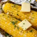 Grilled corn on the cob serving on a barbecue grill